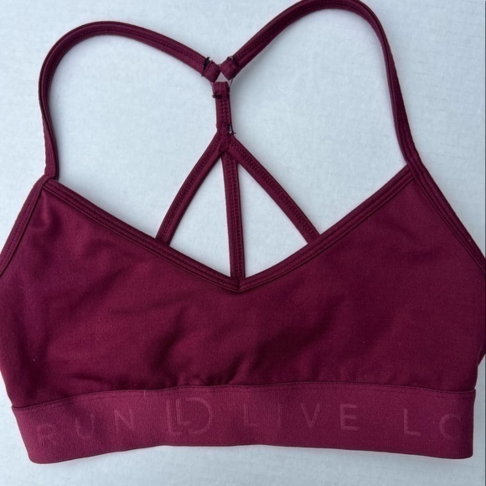 Women’s Live Love Dream sports bra. Maroon. Size small.